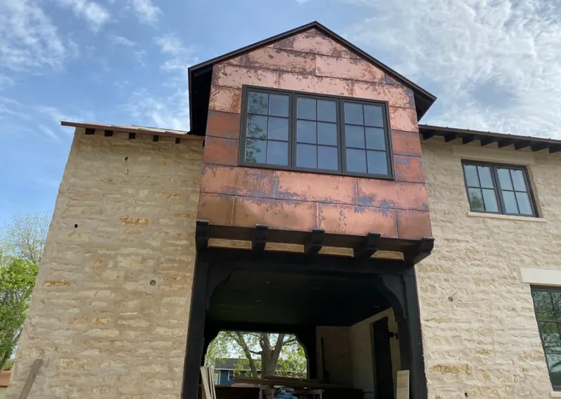 Copper metal panel facade on a stone building for Skylight Installation in Murrysville